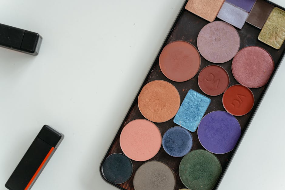 A colorful array of eyeshadows in a palette captured in a flat lay style, perfect for beauty and cosmetic themes