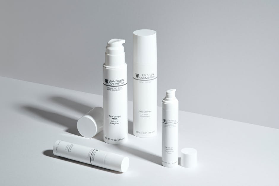 A minimalistic display of skincare bottles showcasing Janssen Cosmetics with a clean white backdrop
